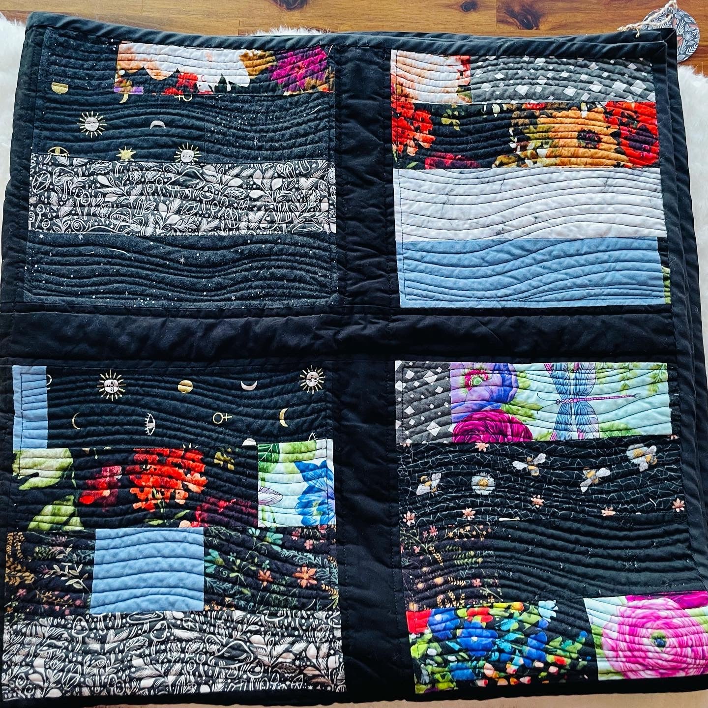 Quilt in Black, Blue, Violet and Grey.